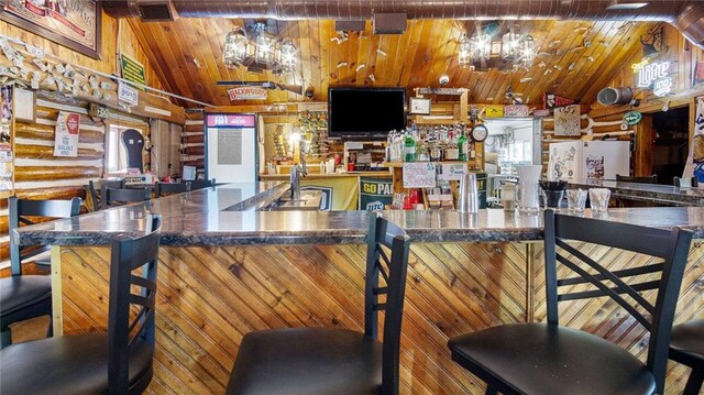 14549 Plummer Rd, Weyerhaeuser, WI 54895 - kitchen with vaulted ceiling, white refrigerator, and wooden ceiling