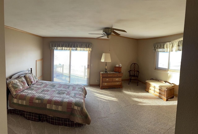 bedroom featuring ceiling fan, crown molding, access to outside, and multiple windows