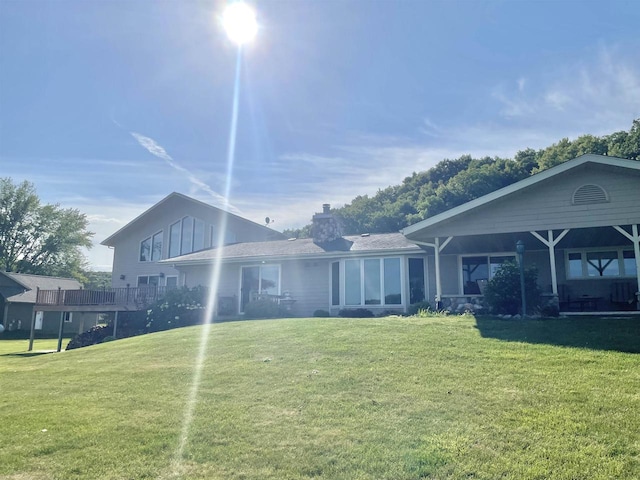 rear view of house with a lawn