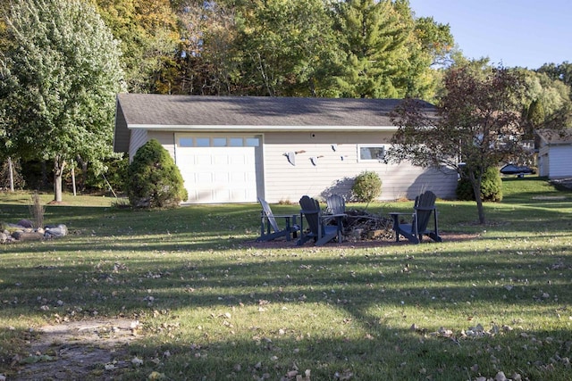 garage featuring a yard