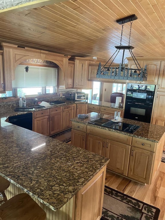 kitchen with black appliances, light hardwood / wood-style flooring, wooden ceiling, a kitchen island, and hanging light fixtures