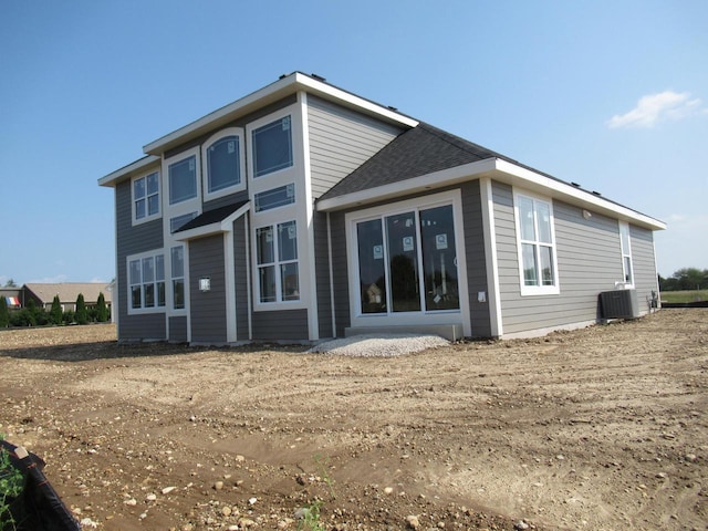 rear view of house with cooling unit