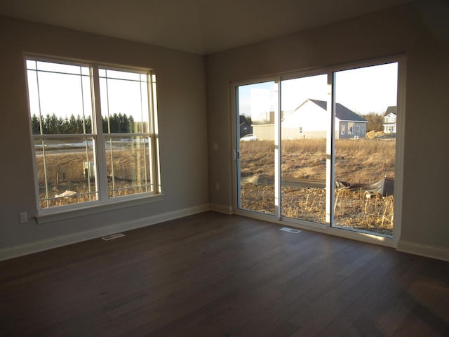 empty room with dark wood-type flooring