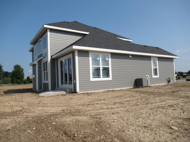 back of property with central AC unit