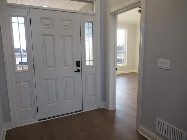 foyer entrance featuring dark hardwood / wood-style flooring