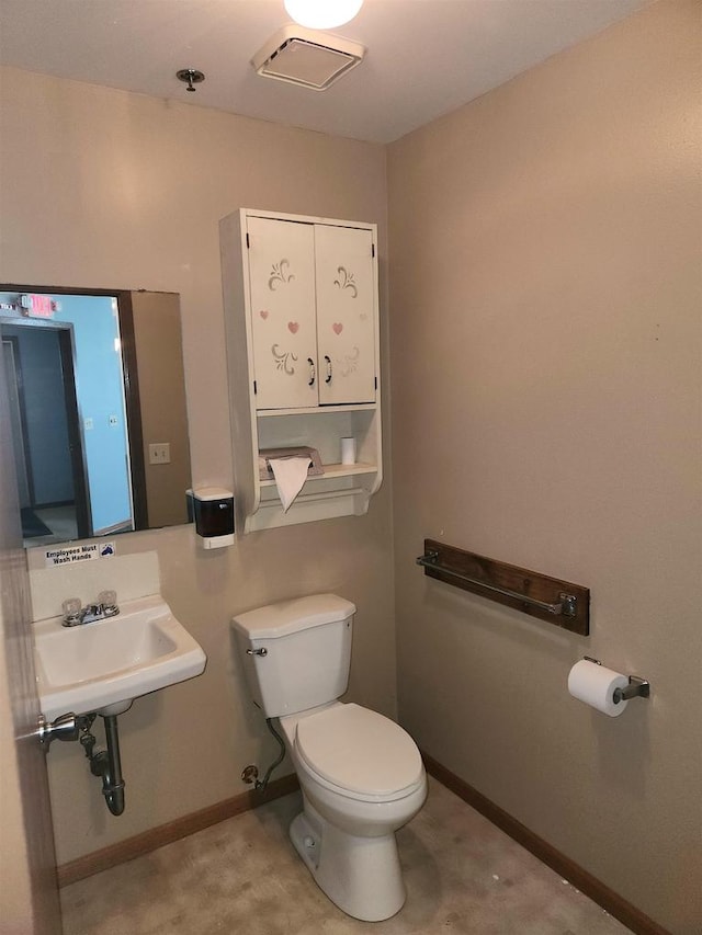 bathroom with sink and toilet