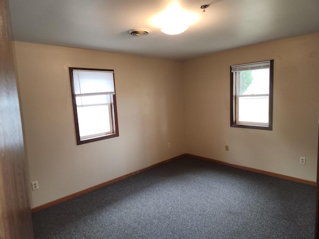 empty room with carpet flooring