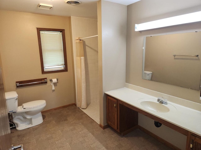 bathroom with toilet, walk in shower, and sink