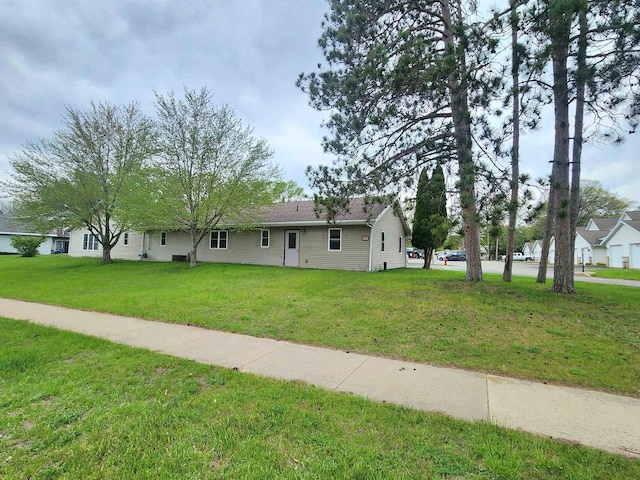 ranch-style house featuring a front lawn