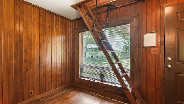 room details with wooden walls and wood-type flooring