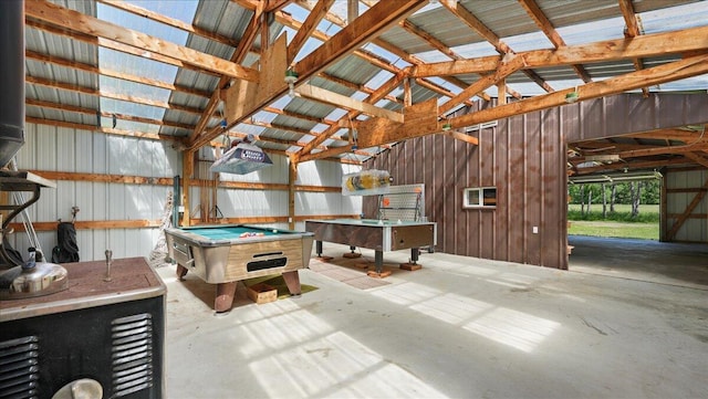 recreation room featuring lofted ceiling with beams, wood walls, and pool table