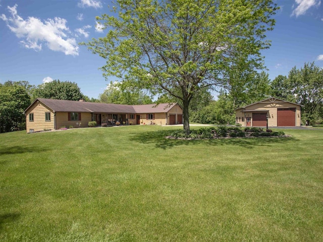 single story home with a front yard and a garage