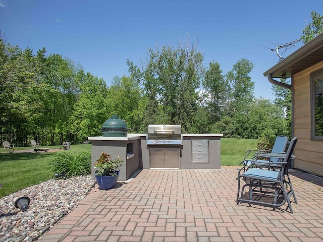 view of patio with exterior kitchen and grilling area