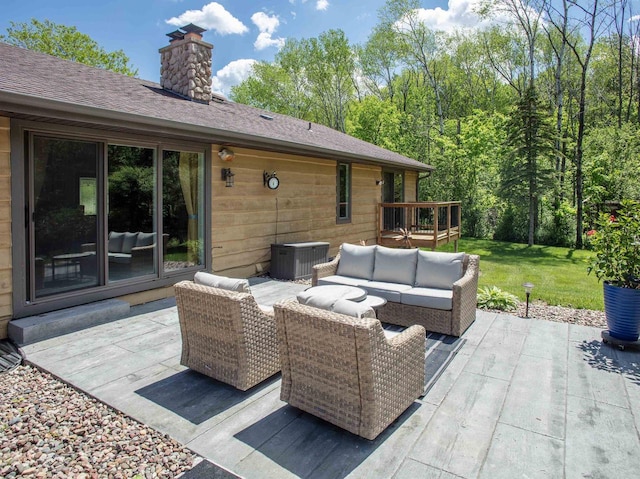 view of patio featuring a wooden deck, cooling unit, and an outdoor hangout area