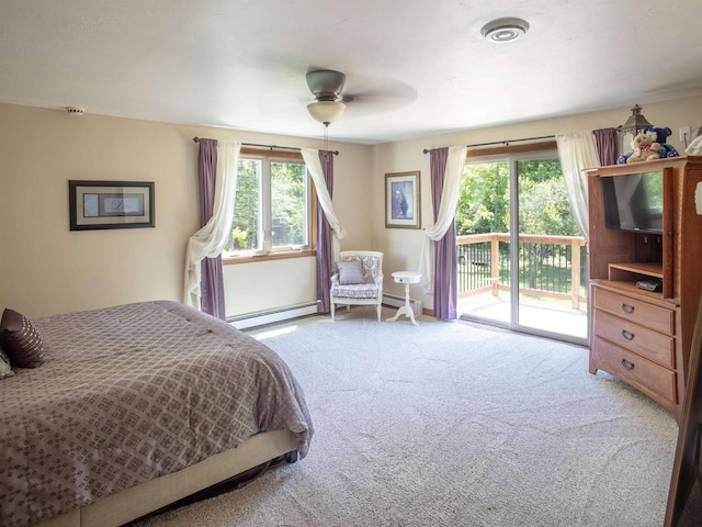 carpeted bedroom with ceiling fan, access to outside, and a baseboard radiator