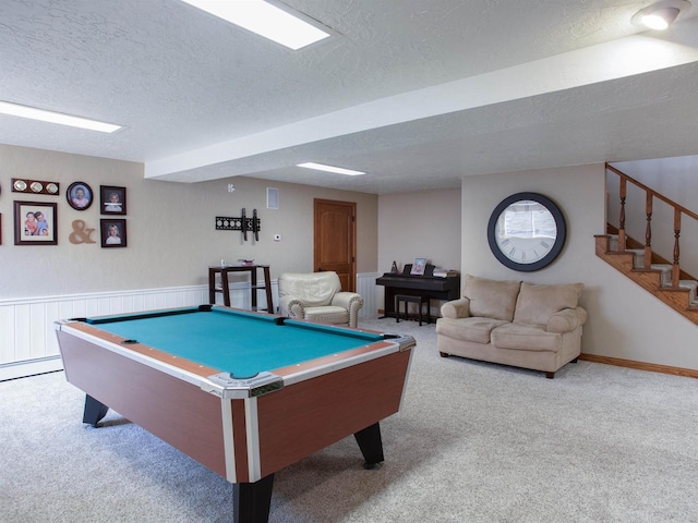 rec room featuring light colored carpet, a textured ceiling, and pool table