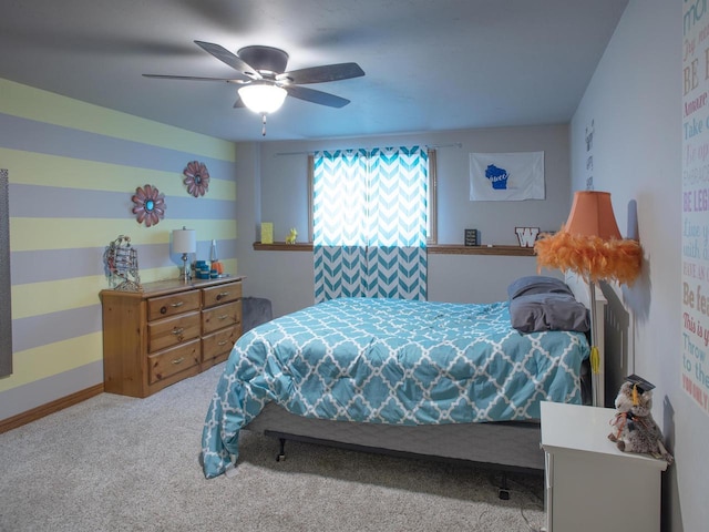 bedroom with ceiling fan and carpet floors