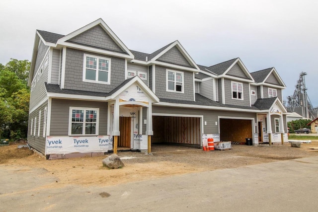 view of front of house featuring dirt driveway and an attached garage