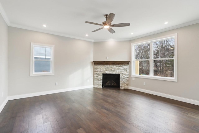 unfurnished living room featuring dark wood-type flooring, ornamental molding, and baseboards