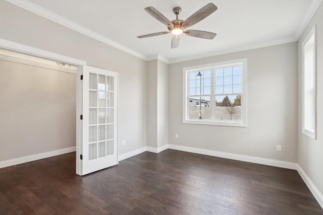 unfurnished room featuring a wealth of natural light, baseboards, and wood finished floors