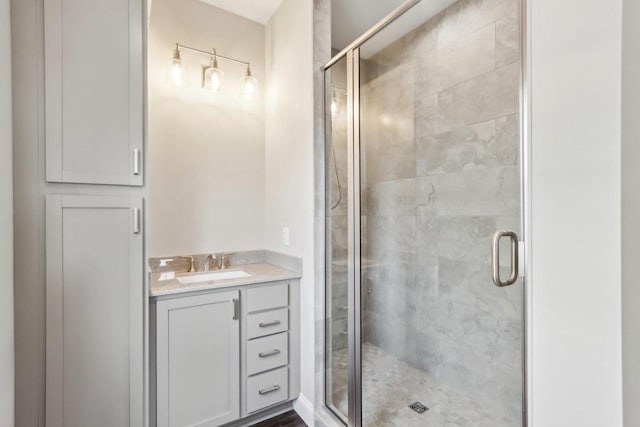 full bath featuring a stall shower and vanity