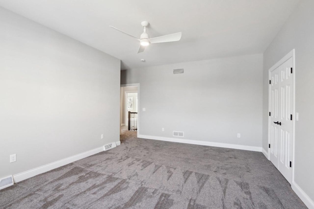 unfurnished bedroom featuring baseboards, visible vents, and carpet flooring