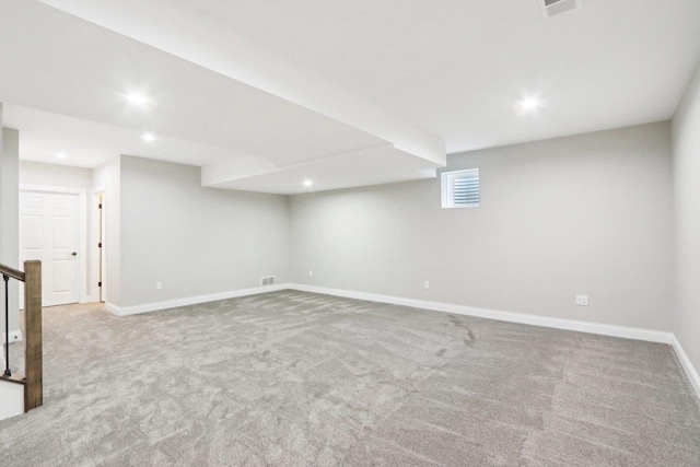 basement with carpet, visible vents, baseboards, and recessed lighting