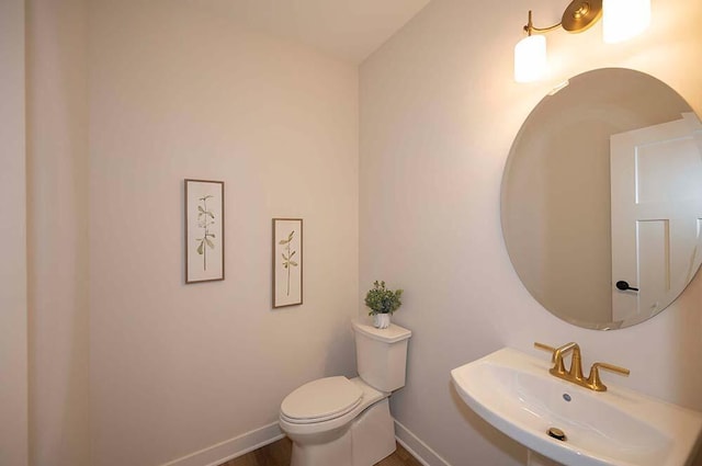 bathroom with sink and toilet