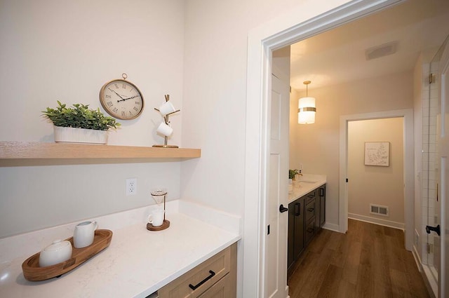 bathroom with vanity and hardwood / wood-style flooring