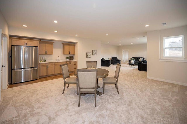 dining area with light carpet