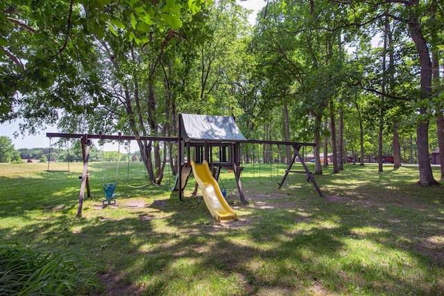 view of jungle gym featuring a lawn