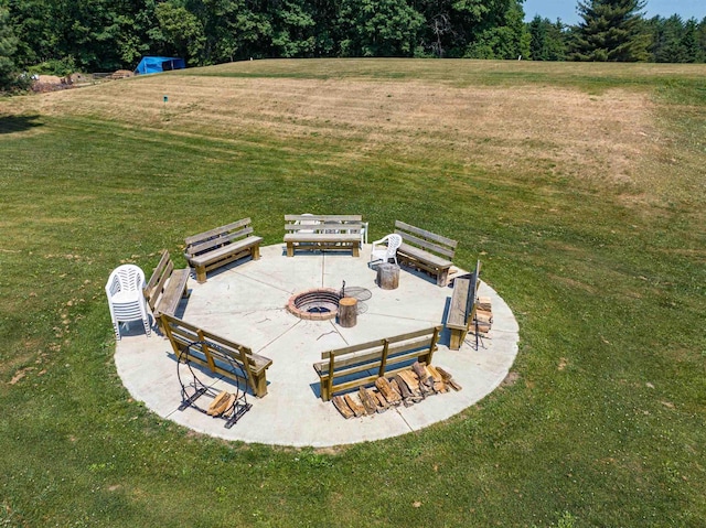 view of yard with a patio and an outdoor fire pit