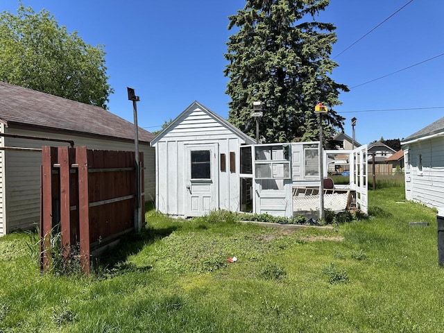 view of outbuilding featuring a lawn