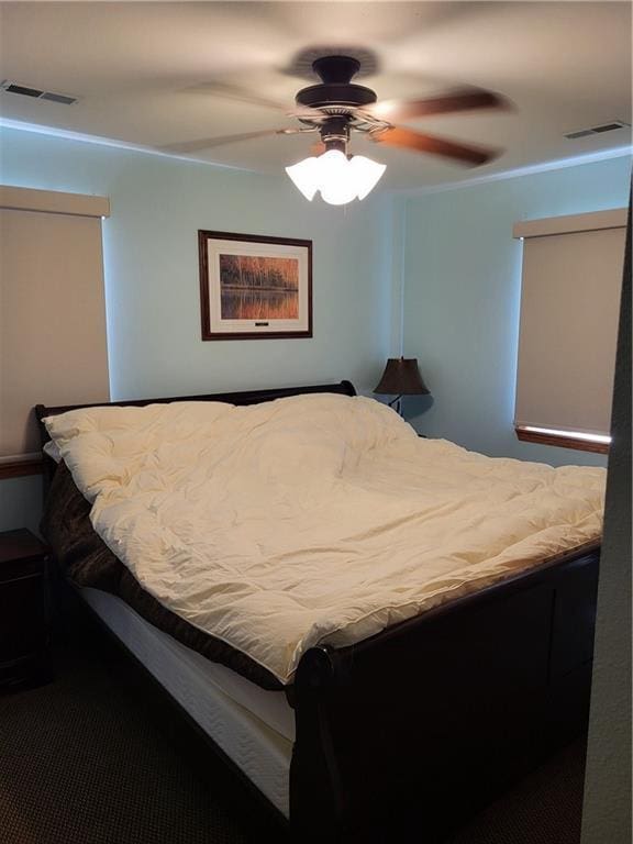 carpeted bedroom with ceiling fan