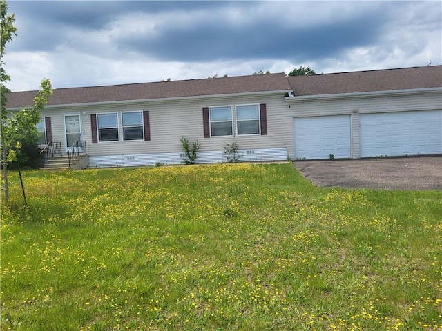 view of front facade with a front lawn and a garage