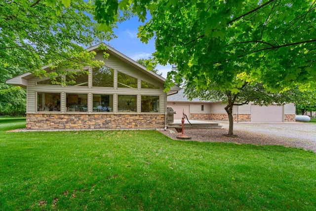 exterior space with a lawn and a garage