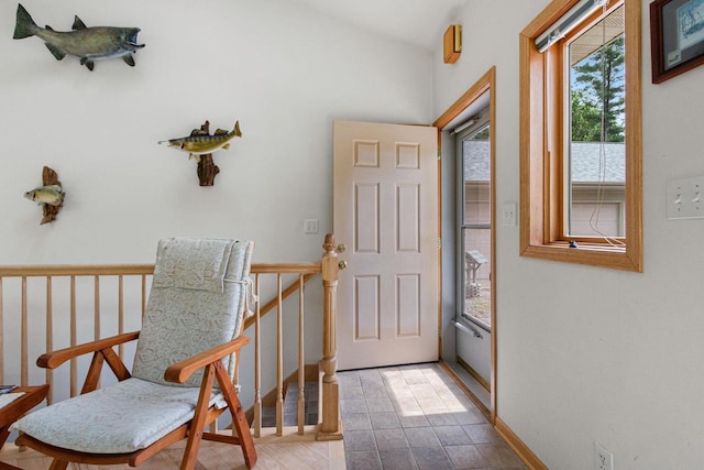 foyer entrance featuring lofted ceiling