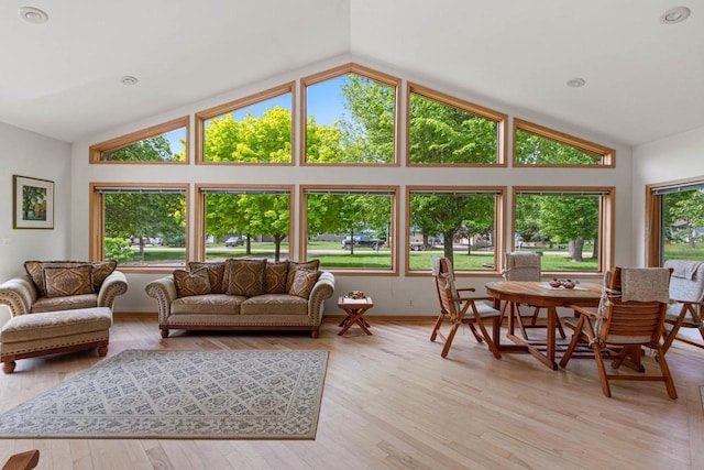 sunroom / solarium featuring a wealth of natural light and lofted ceiling