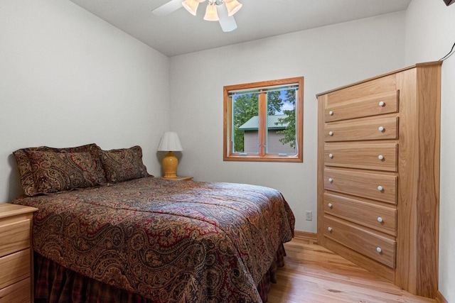 bedroom featuring ceiling fan and light hardwood / wood-style floors