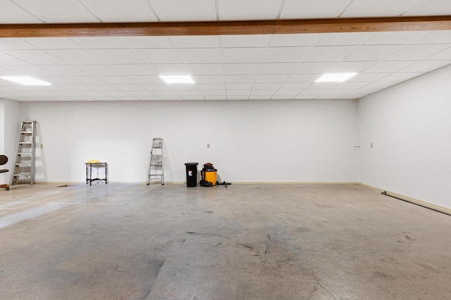 basement featuring a drop ceiling