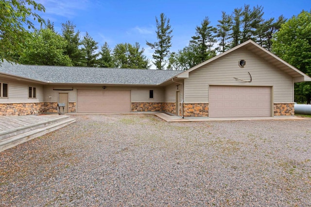 ranch-style house featuring a garage