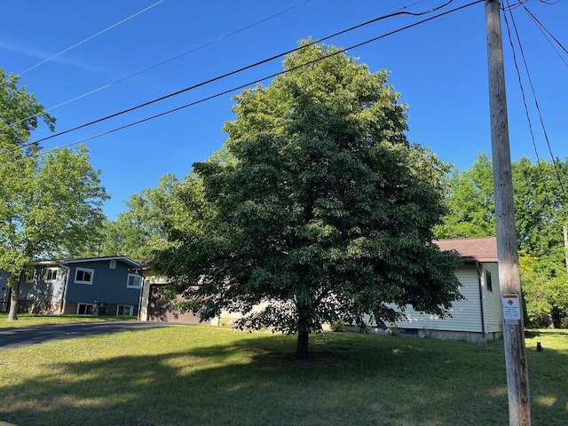 view of property exterior with a lawn