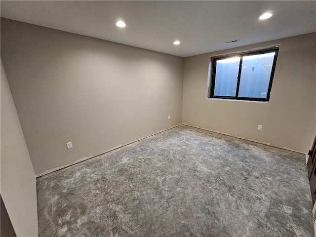 carpeted spare room featuring recessed lighting and visible vents