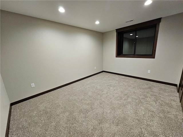 empty room with recessed lighting, carpet flooring, visible vents, and baseboards