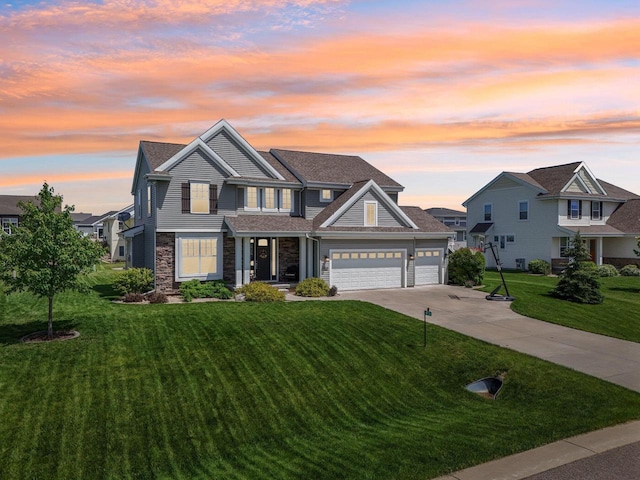 craftsman inspired home with a yard and a garage