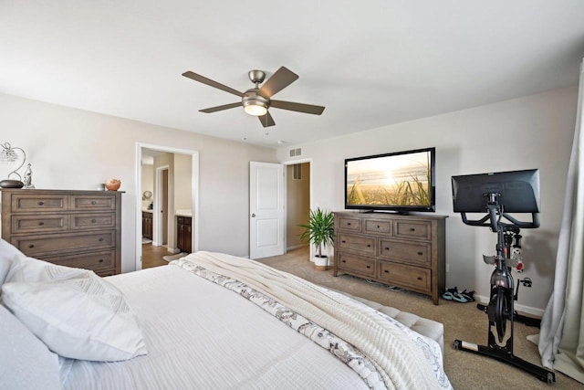 carpeted bedroom with connected bathroom and ceiling fan