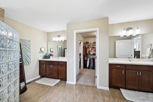 bathroom with vanity and hardwood / wood-style flooring