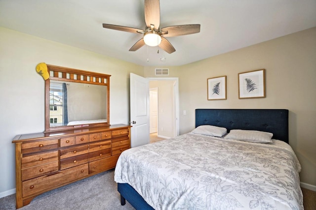 bedroom with ceiling fan and light colored carpet