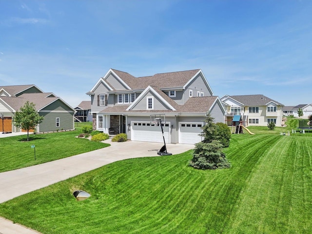 view of front of home with a front yard and a garage