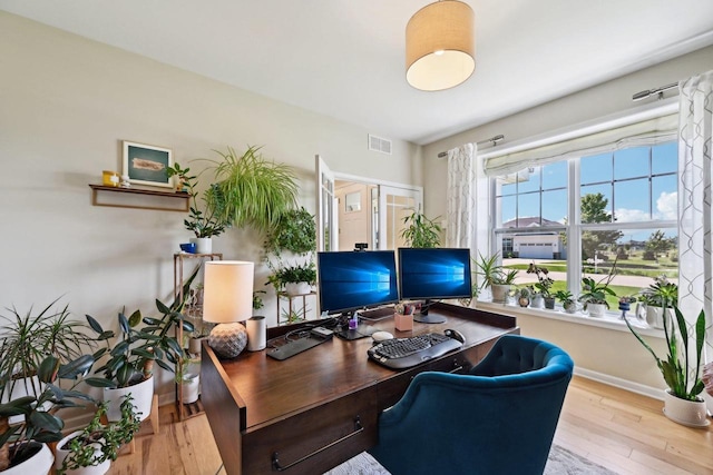 office with light hardwood / wood-style floors